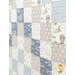 A close up on the patchwork, showing details on the blue, white, and taupe fabrics.