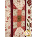 A super close up on a patchwork section of the quilt, showing details on a nine patch block.