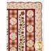 A closer look at the upper right corner of the quilt, showing details on the layout as well as the scalloped border and binding.