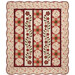 The completed Sunday Picnic Quilt, colored in warm fabrics from the Hearth & Home collection by Henry Glass Fabrics, isolated on a white background. 