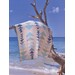 One of the quilts draped over a tree branch on the beach.