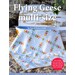 Front cover of the pattern book, showcasing one of the quilts included in the book draped across a boat on the sand.