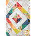 A close up on the center of the wall hanging, demonstrating fabric prints and color details.