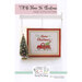 Front cover of the I'll Be Home For Christmas cross stitch pattern of the finished product in frame and surrounded by coordinating décor.