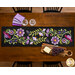 A top down shot of the runner, showing layout details on the appliqué florals, leaves, and vines.