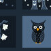 The closeup of an indigo blue fabric panel featuring assorted Halloween blocks with ghosts, pumpkins, bats, owls, mushrooms, spiderwebs, stars, stripes, and spooky trees.