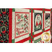 An angled close up on the quilt, demonstrating details on the panel album blocks.