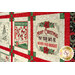 An angled close up on the quilt, demonstrating details on the panel album blocks.