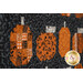 A close up on a row of patchwork pumpkins, showing fabric print and color details.