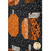 A close up on two patchwork pumpkins, showing details on the patchwork as well as fabric colors and prints.