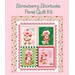 Patchwork quilt with four Strawberry Shortcake illustrations and floral border on a pink background