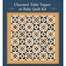 Mockup of the quilt, colored in yellow, cream, and blue fabrics from the Denim and Daisy collection. on a blue background