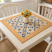 Mockup of the quilt, staged on a cream table.