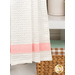 A close up on the fabric stripe through the bottom of the towel.
