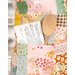 A close up shot showing off the large functional pockets on the front of the simply charming apron. 