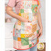 A model wears the apron, demonstrating use of the dimensional front pocket.