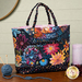 A shot of the backside of the bag, showing details on the floral prints and pocket.