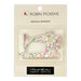 pink, orange, and green floral sewing machine magnetic needle minder in it's packaging