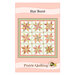 Star Burst quilt pattern cover showing a nine-block geometric quilt in peach, coral, cream, and soft green with coordinating borders.