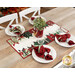 A lifestyle shot of the runner, staged on a wooden table with coordinating table settings and flowers.