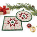 A closer look at the two Folded Star Hot Pads, demonstrating fabric color and print details.