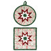 The two completed Folded Star Hot Pads colored in red, cream, and mint green fabrics from the Evergreen Wishes collection by Riley Blake Designs, isolated on a white background.