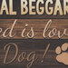 an 8x8 swatch of the panel featuring words, and a dog paw print on a brown wood textured background.