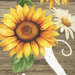 an 8x8 swatch of the panel featuring a sunflower, a daisy, and part of the letter "S" on a wood textured background.