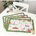 The four completed Self-Binding Placemats, fanned out and colored in red, green, and white fabrics from the Barnyard Christmas collection by Northcott Fabrics, staged on a white table with coordinating décor.