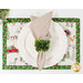A top down shot of the placemat, staged on a white table with coordinating plate and cloth napkin, showing details on the print.