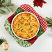 A top down shot of the bowl cozy with a white bowl nestled inside, full of Shepherd's Pie, demonstrating functionality.