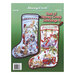 Back cover of the cross stitch pattern with the finished stockings on a green background.