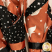 A close up on the napkins, demonstrating fabric color and print details.