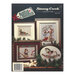 Back cover of the cross stitch pattern with the finished projects staged on a decorated background.