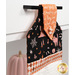 A shot of the top section of the towel taken from a slight angle, showing details on the bell fabric as well as the fabric button.