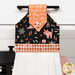 A close up on the top section of the towel, showing details on the bell fabric as well as the fabric button.