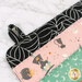 A super close up on the mat showing details on the fabric loop for hanging and drying the project.