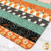 A super close up on the mat demonstrating fabric prints and color details.
