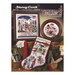 Front cover of the cross stitch pattern with the finished projects staged on a decorated background.