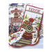 Front cover of the pattern booklet showing the finished stocking displayed on a landscaped background.