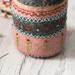 A close up on the pincushion, showing details on the embroidered stitching.