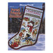 Front cover of the pattern booklet showing the finished stocking displayed on a winter forest background.