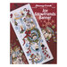 Front cover of the cross stitch pattern with the finished banner staged on a red background.