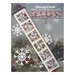 Front cover of the cross stitch pattern with the finished banner staged on a Christmas tree background.