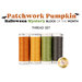 Four spools of orange, yellow, green, and gray thread isolated on a white background. 