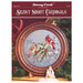Front of the silent night cross stitch pattern showing the finished design framed with coordinated décor.