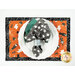 A top down shot of the placemat, staged with a white plate and coordinating gray and mint green cloth napkin.