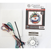 Jolly Snowman Tin Kit with pieces and included items on display over a white background.