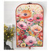 The back of the project colored in a vibrant poppy themed panel, staged on a hanger against a white shiplap wall with coordinating flowers.