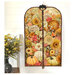 The completed project colored in a vibrant panel with an autumn floral scene, staged on a hanger against a white shiplap wall with coordinating flowers.